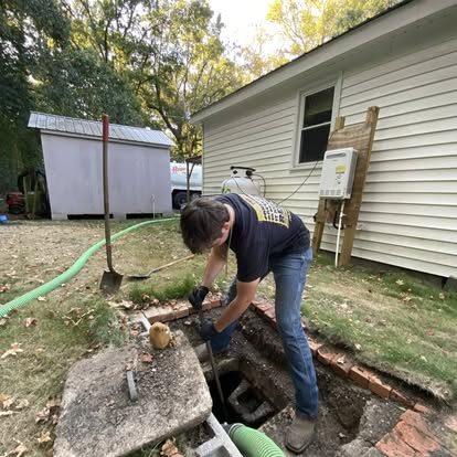 Hinson plumbing service in a residential yard
